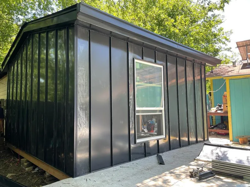 Black standing seam metal wall panels for Roof Inspection in Olive Branch